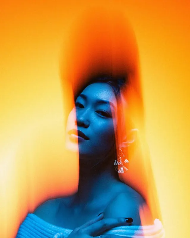 Portrait with color gels and blue lighting, photographic, gradient-heavy, vibrant