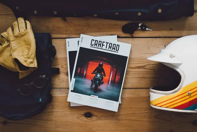 Craftrad motorcycle magazine flatlay, photographic, editorial, warm