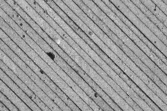 Concrete texture detail study, photographic, minimalist, monochrome