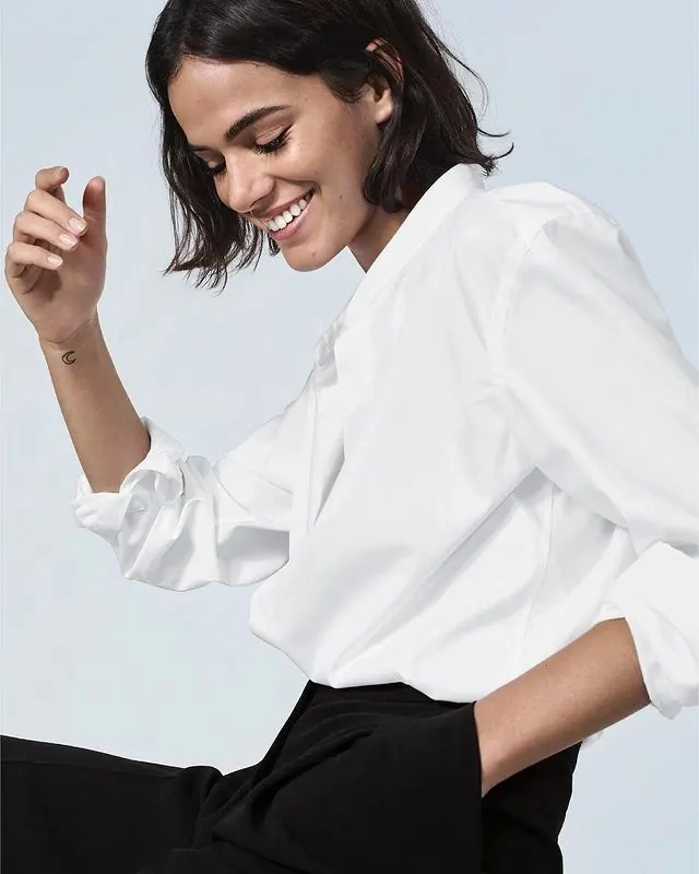Portrait of woman in minimalist white shirt, photographic, minimal, light
