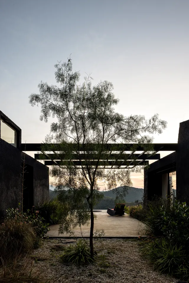 Casa Preta interior courtyard with pergola, photographic, minimalist, light