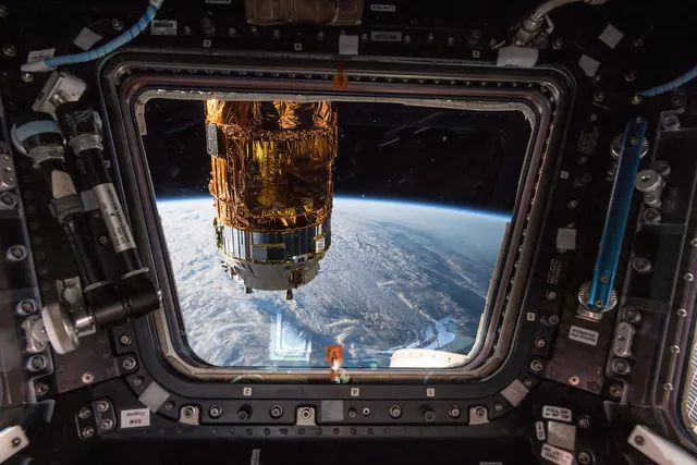 Space station cargo module photograph, photographic, dark
