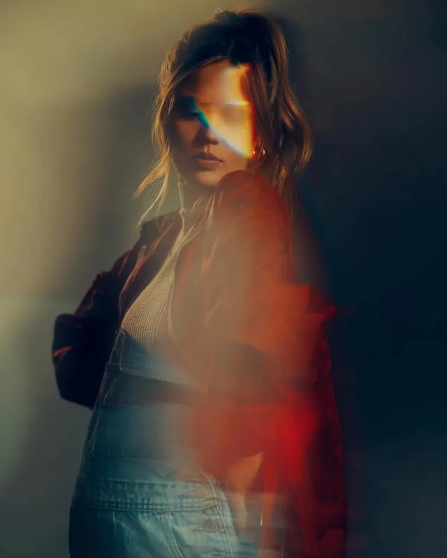 Portrait with warm color wash overlay, photographic, gradient-heavy, warm