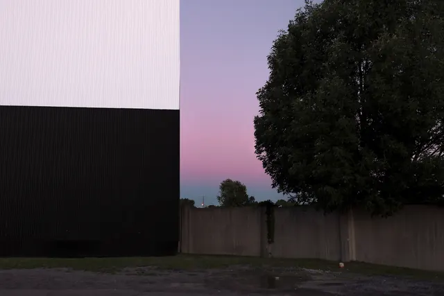 Geometric concrete structures at dusk, photographic, minimalist, dark