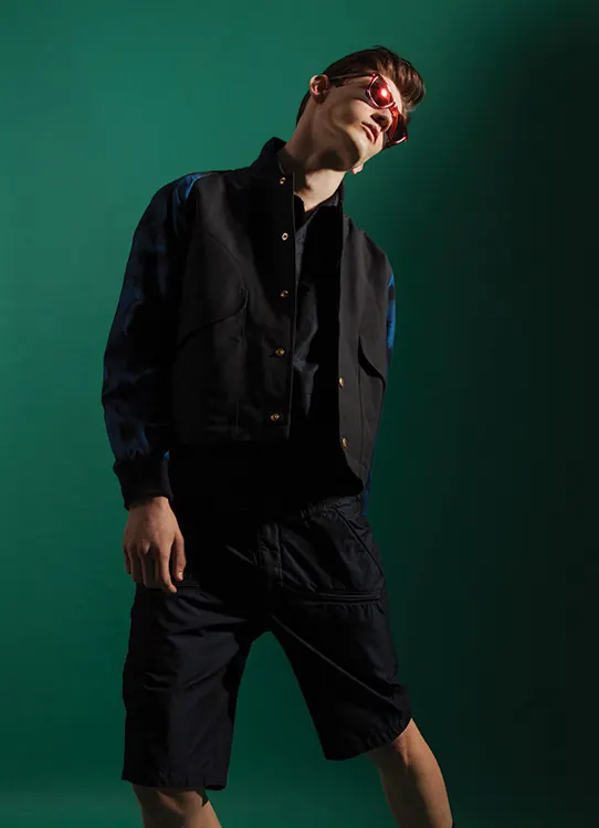 Portrait with teal background, photographic, minimal, cool