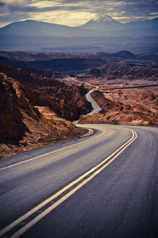 Winding mountain road landscape, photographic, warm