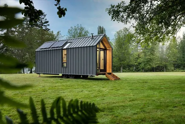 Modern prefab dwelling on wheels, minimal, technical, dark