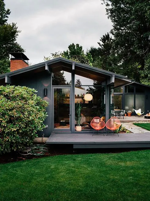 Modern residential pavilion with red chairs, photographic, minimal, warm