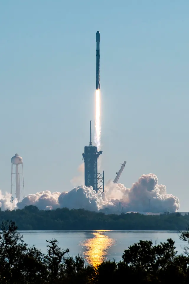 Rocket launch over water at dawn, photographic, technical, cool