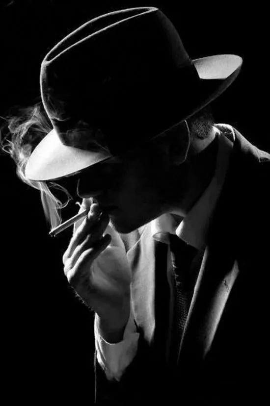 High-contrast black and white portrait with dramatic lighting, photographic, monochrome, monochrome