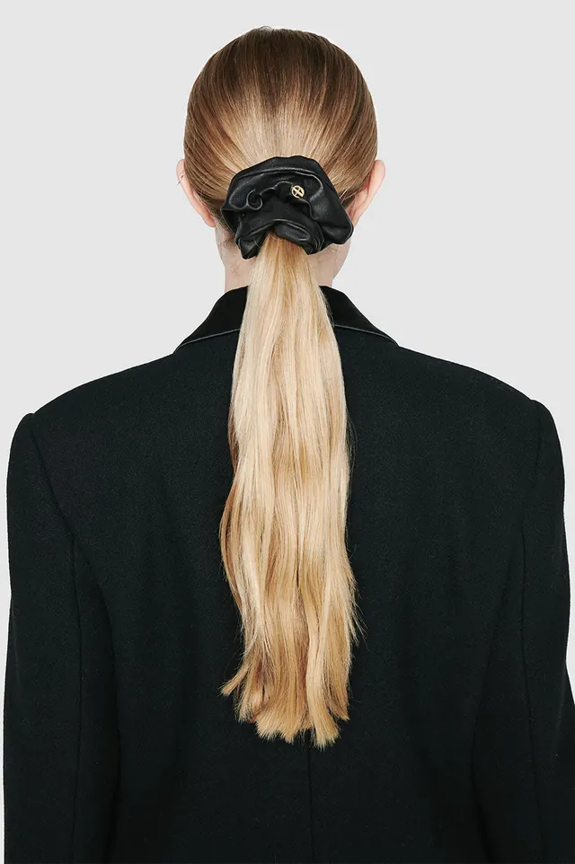 Woman in Black Suit with Hair Accessory