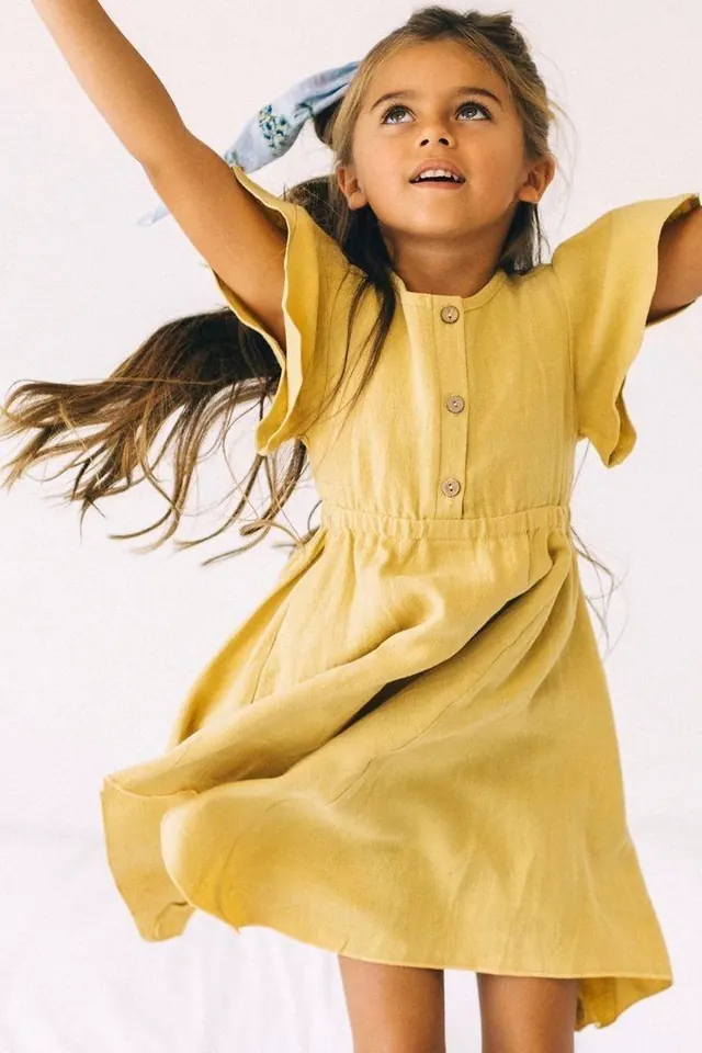 Child in yellow dress portrait, photographic, editorial, light