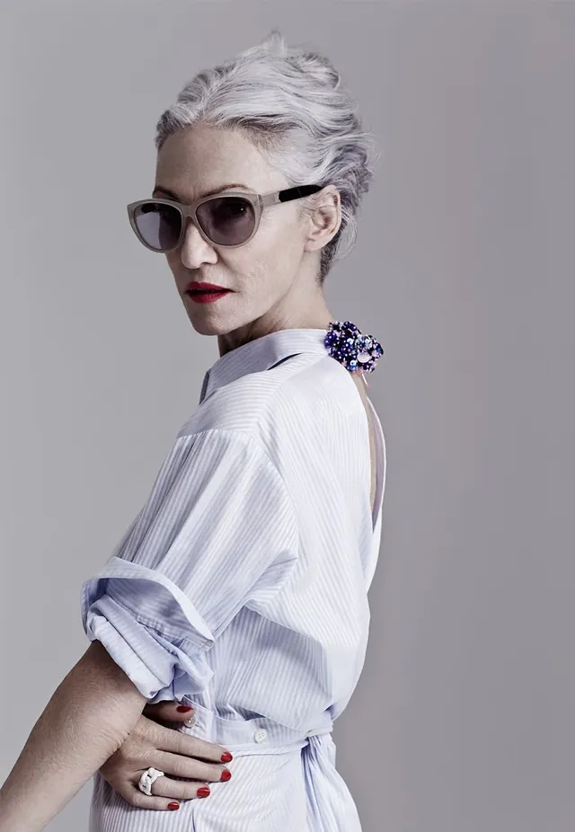 Studio portrait with sharp-framed sunglasses and formal shirt, photographic, minimal, light