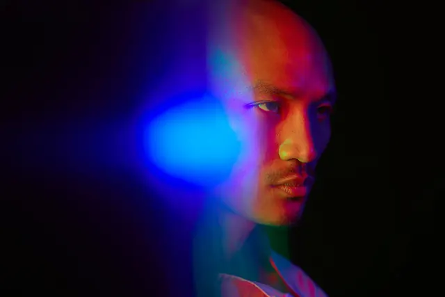 Chromatic light portrait with multi-colored gels, 3d-render, gradient-heavy, vibrant