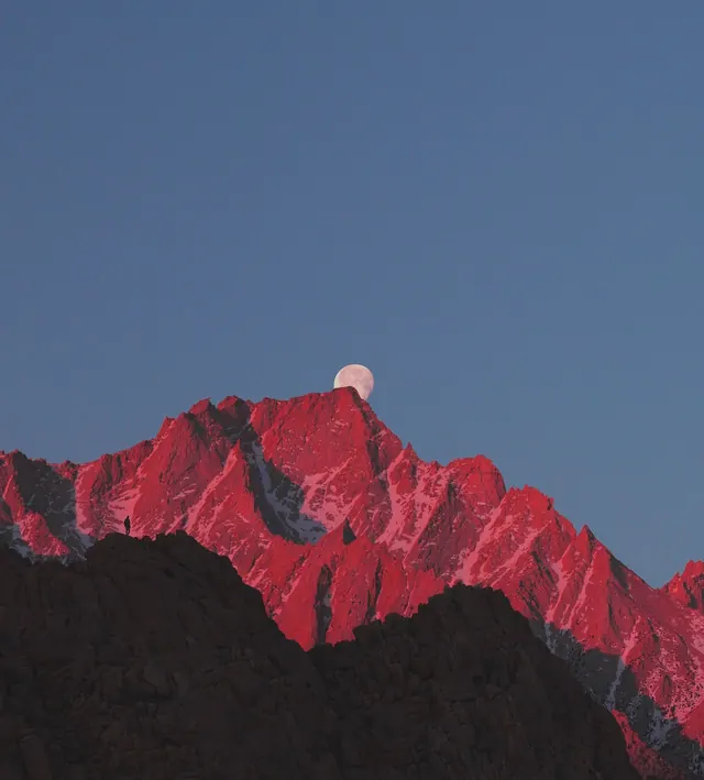 Alpine moonrise mountain landscape, photographic, editorial, warm