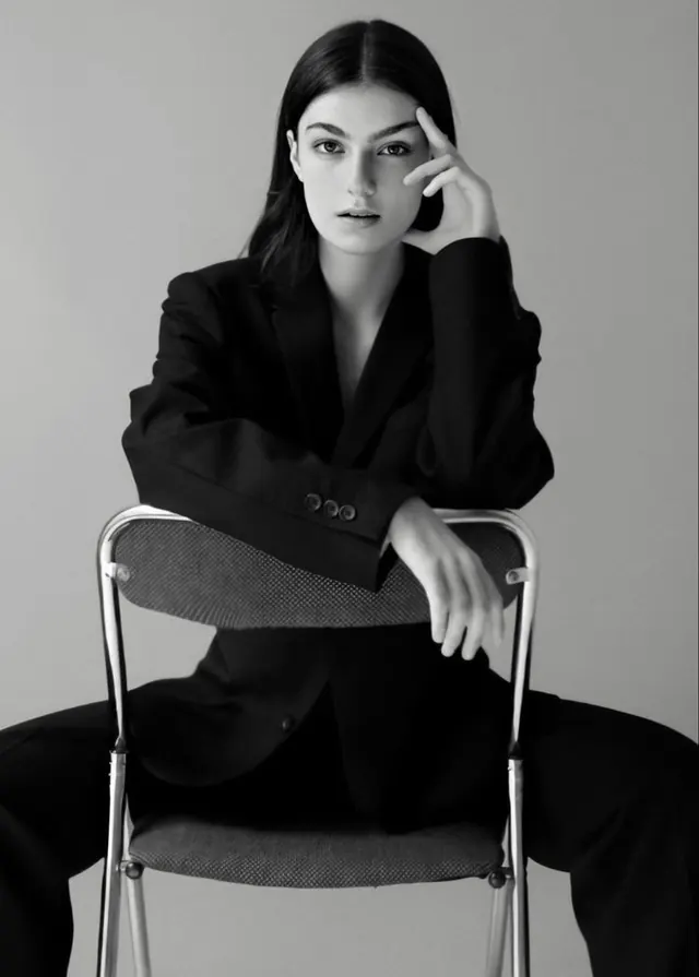 Monochrome portrait with chair composition, photographic, minimal, monochrome