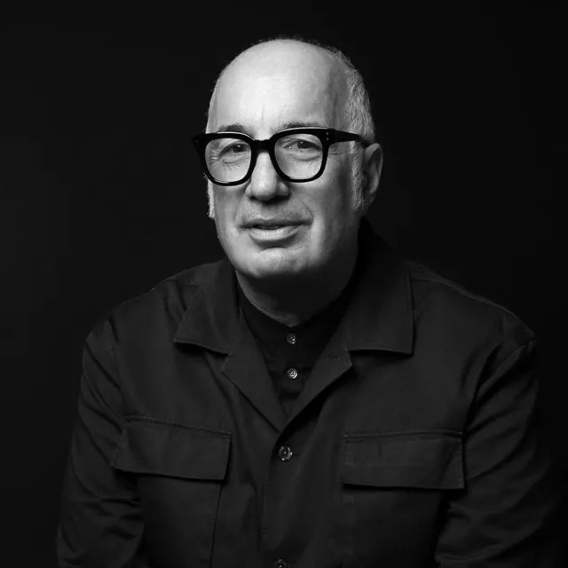 Black and white studio portrait with strong directional lighting, photographic, portrait, vibrant