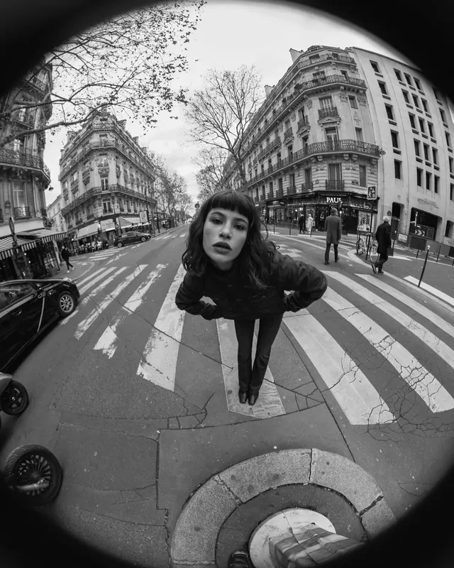 Fish-eye portrait on Parisian street, photographic, editorial, monochrome