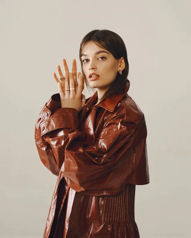 Woman in rust leather jacket portrait, photographic, editorial, warm