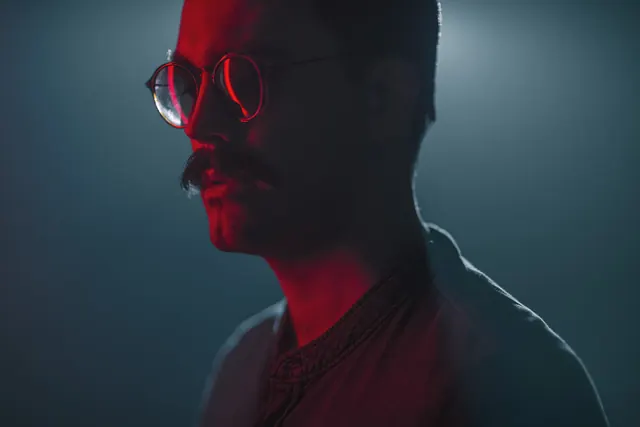 Cinematic portrait with neon lighting, photographic, dark-mode, neon