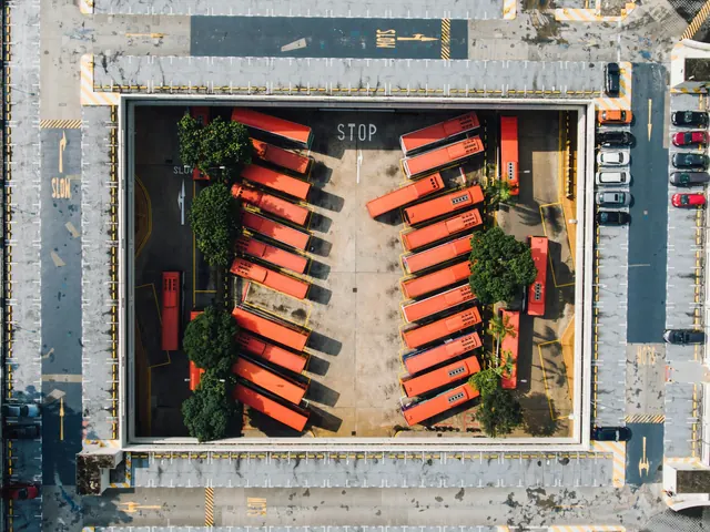 Aerial view of parking lot with red delivery trucks, photographic, geometric, vibrant