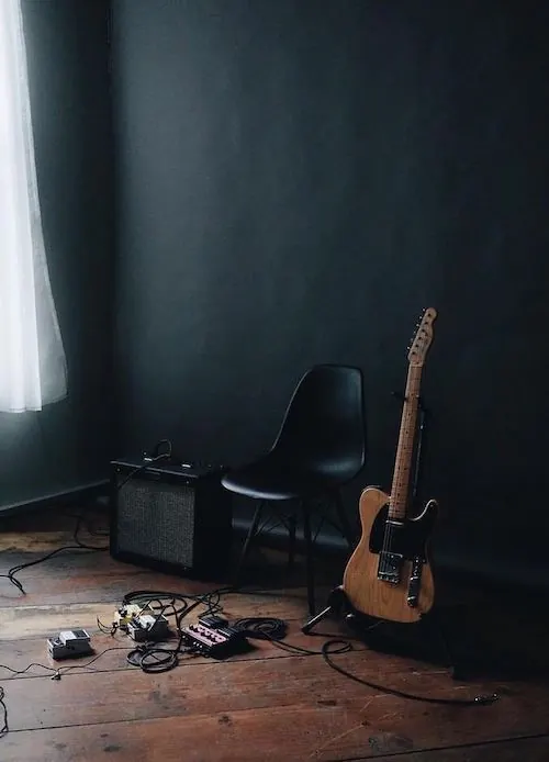 Minimalist studio guitar setup, photographic, minimal, dark