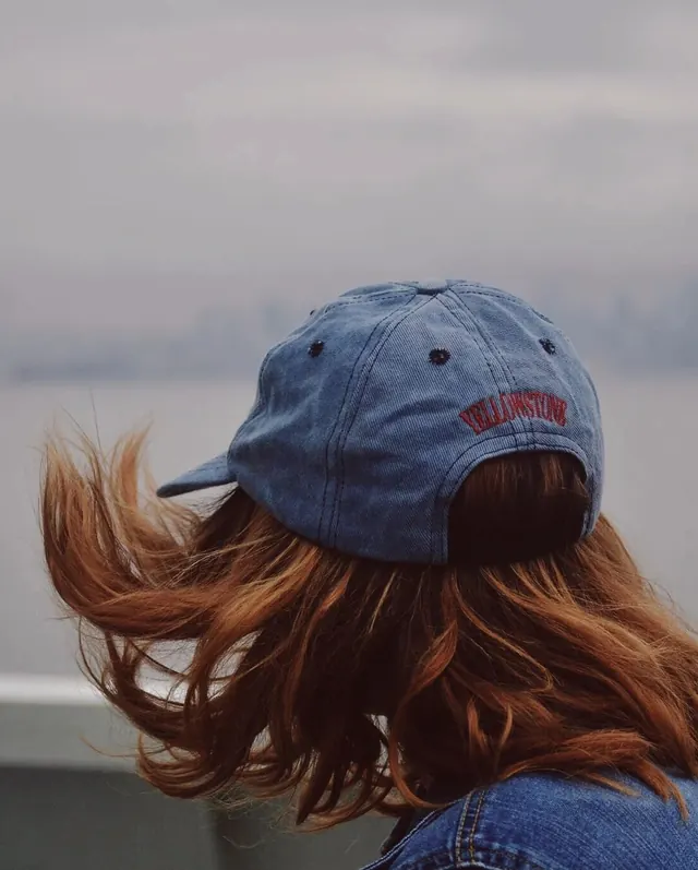 Person wearing blue cap