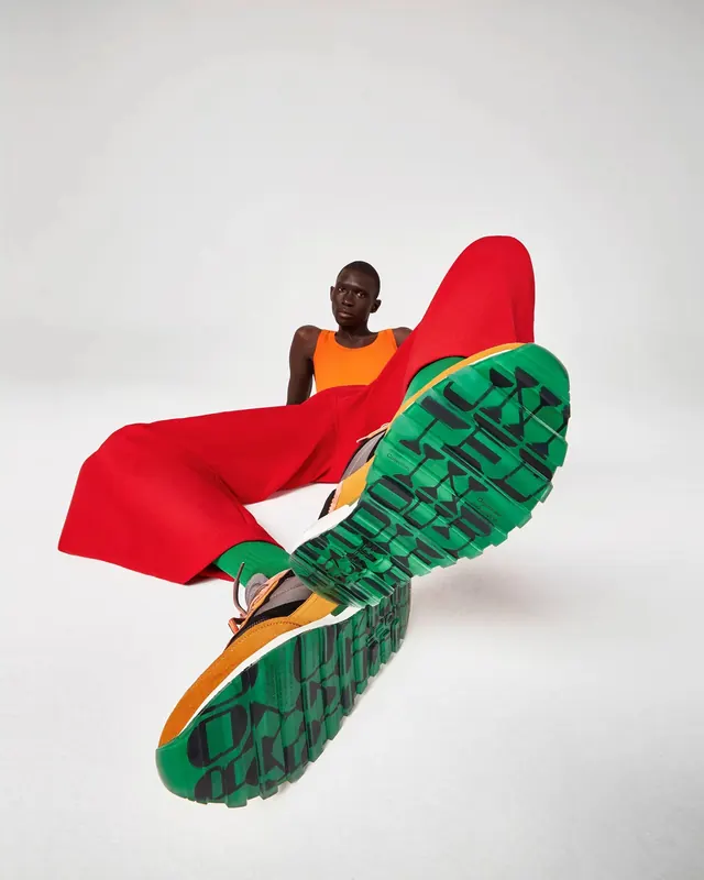 Athlete product photography with dynamic fabric, photographic, playful, light