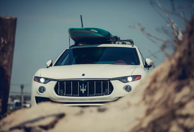 Maserati Levante beach getaway, photographic, minimal, light