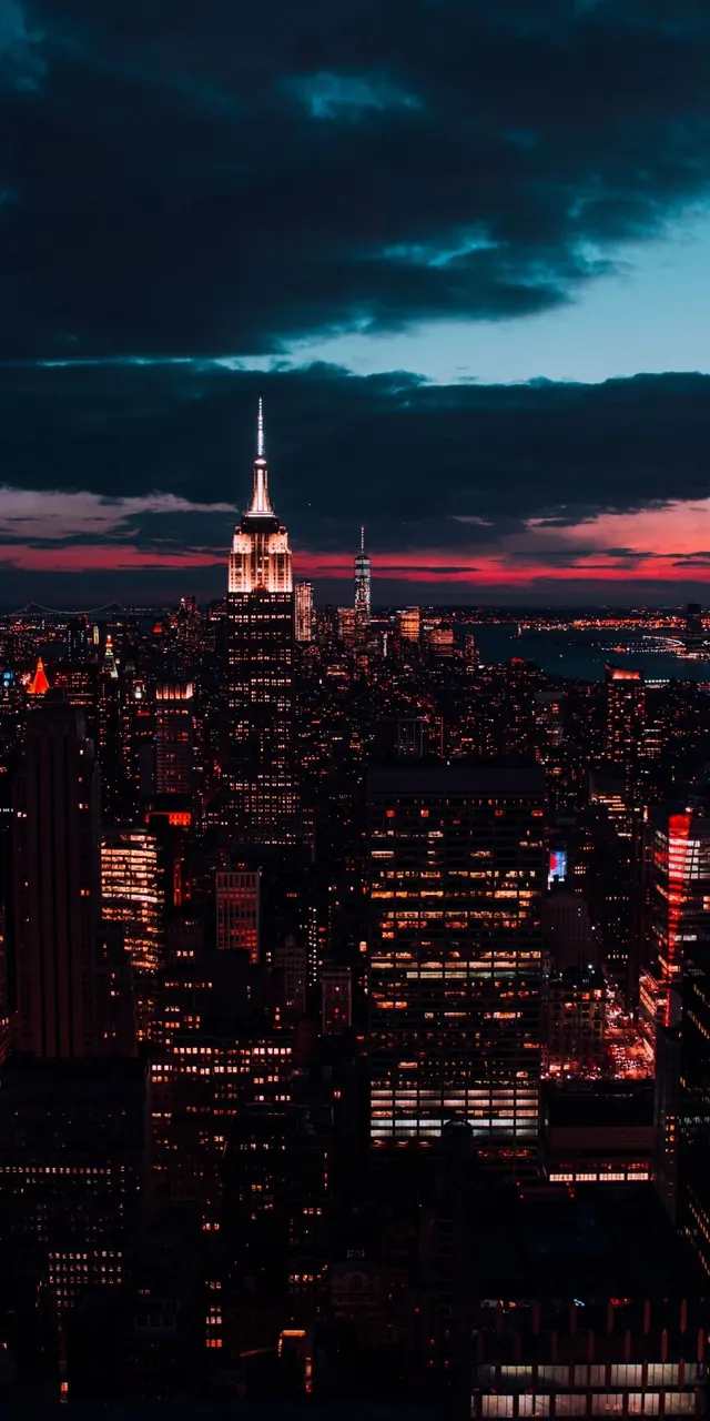 NYC skyline at dusk with Empire State Building, photographic, gradient-heavy, warm
