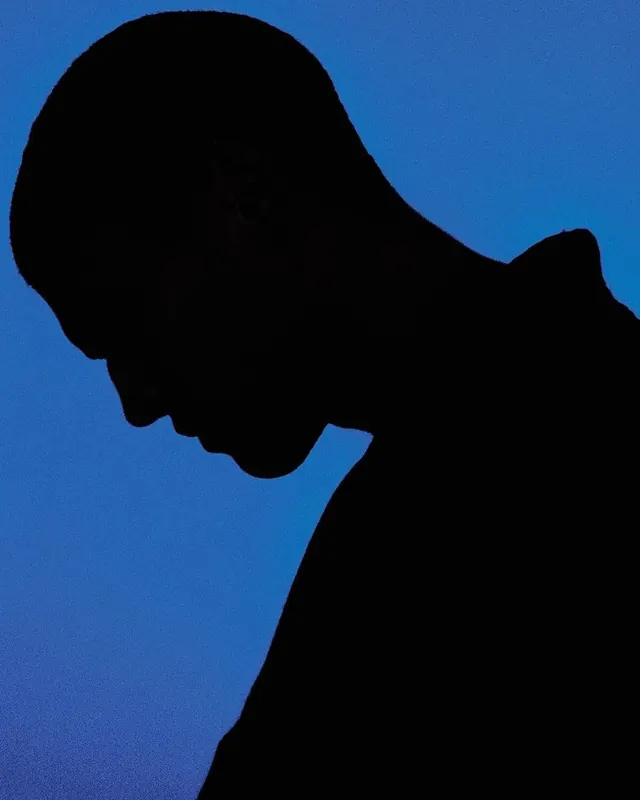 Silhouette Profile against Blue Background
