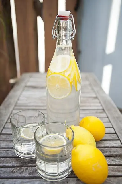 Lemon Infused Water on Wooden Table