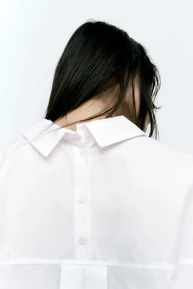 Portrait of a person in a white shirt