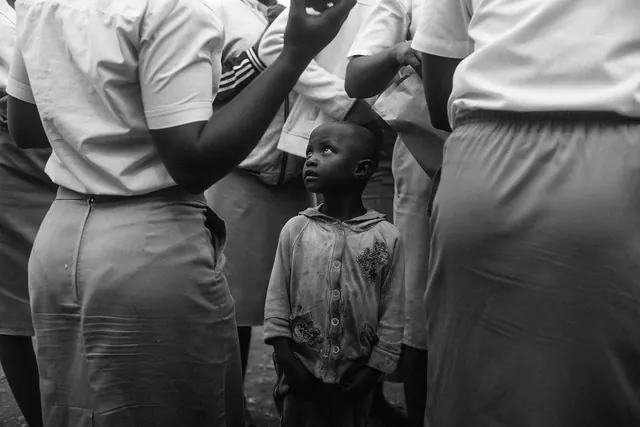 Candid Portrait of a Child in a Crowd