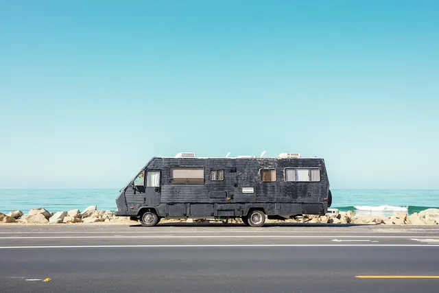 Black Camper Van on Beach