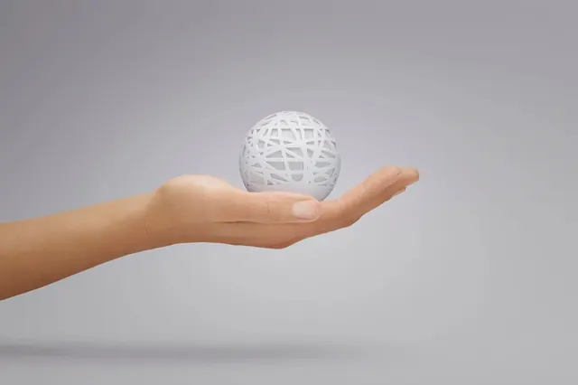 Hand Holding Wireframe Sphere