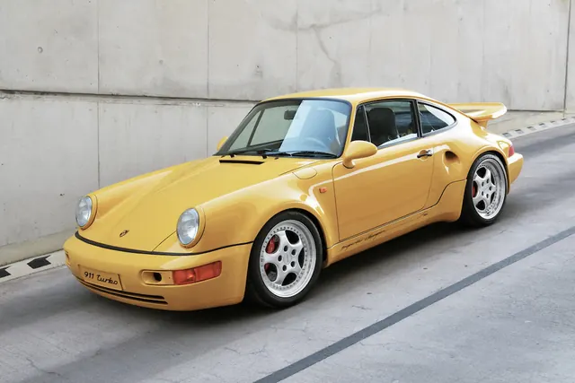 Yellow Porsche 911 on Urban Street