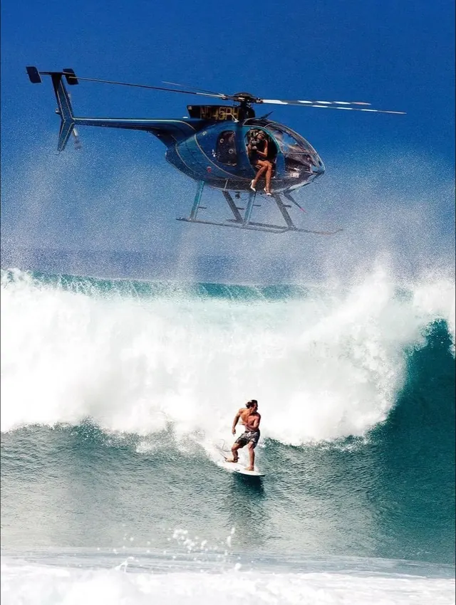 Surfer and helicopter action shot, photographic, vibrant