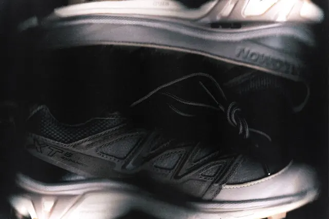 Close-up product photography of running shoe, photographic, minimal, dark