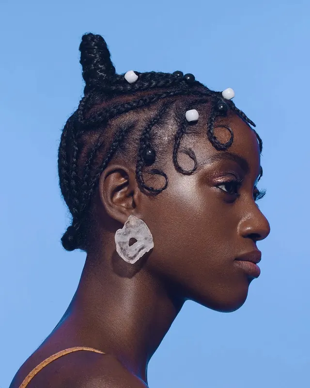 Portrait of a Woman with Braided Hair and Jewelry