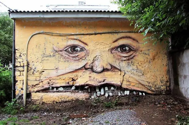 Aged Mural Portrait on Deteriorating Wall, photographic, illustrated, warm