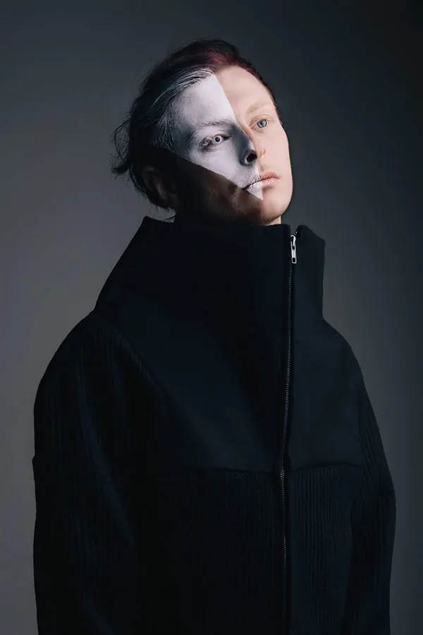 Artistic Split-Face Portrait with Dramatic Lighting, photographic, artistic, dark