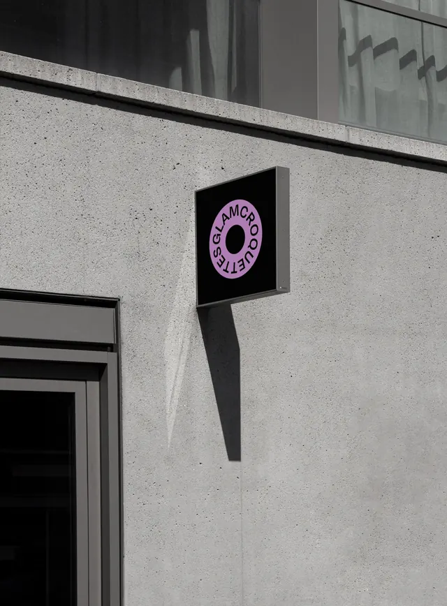Neon Circular Logo Signage on Concrete Storefront, photographic, neo-brutalist, dark