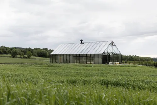 Modern greenhouse in green field, minimal, photographic, light