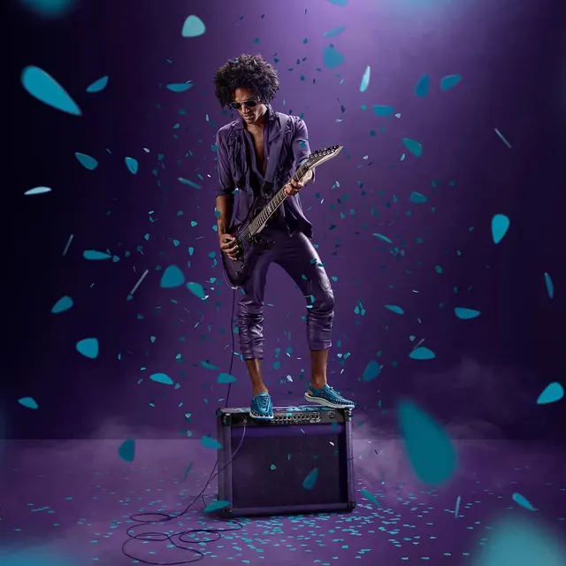 Guitarist on stage with neon confetti, photographic, dark-mode, dark