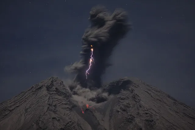 Volcano eruption with lightning at night, photographic, dark-mode, dark