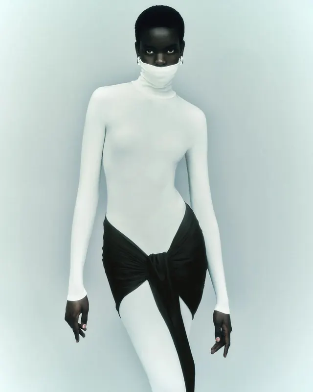 Minimalist fashion figure with contrasting details, photographic, minimal, light