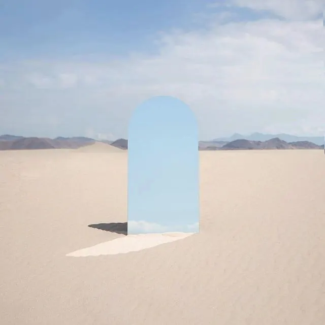 Desert portal with blue archway, photographic, minimal, light