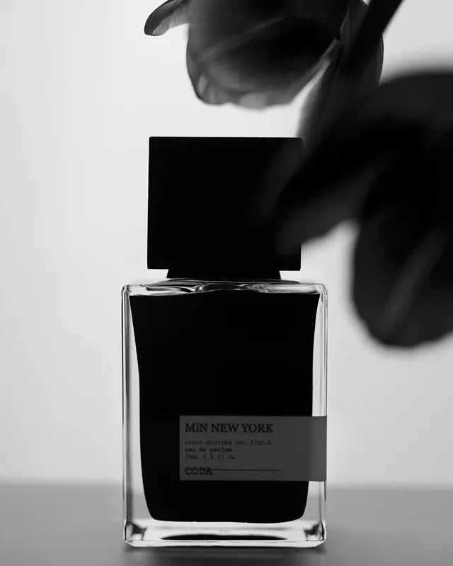 Monochrome fragrance bottle product shot, minimal, photographic, monochrome