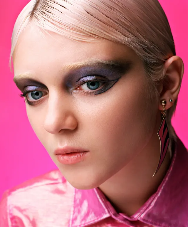 Beauty portrait with bold magenta background, photographic, playful, vibrant
